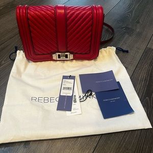 Selling a brand new Rebeca Minkoff crossbody bag in red.
